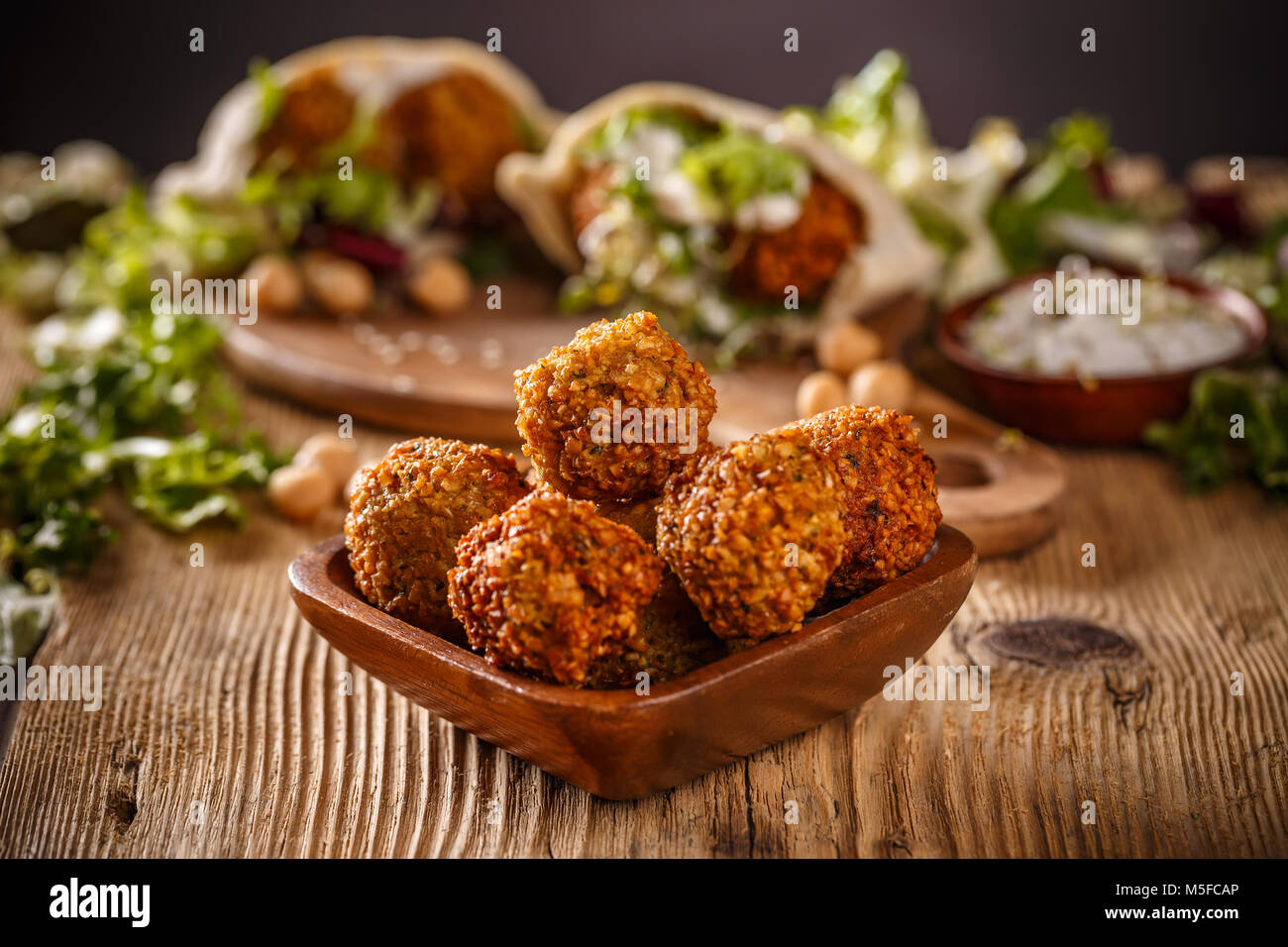 Fresh chickpeas falafel in wooden bowl Stock Photo