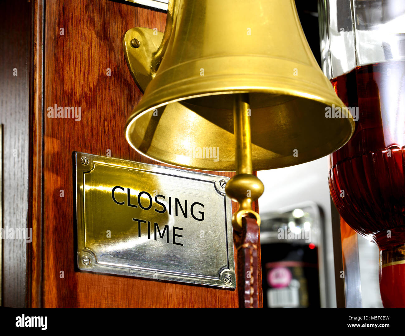 'Closing Time' bell in a British bar Stock Photo