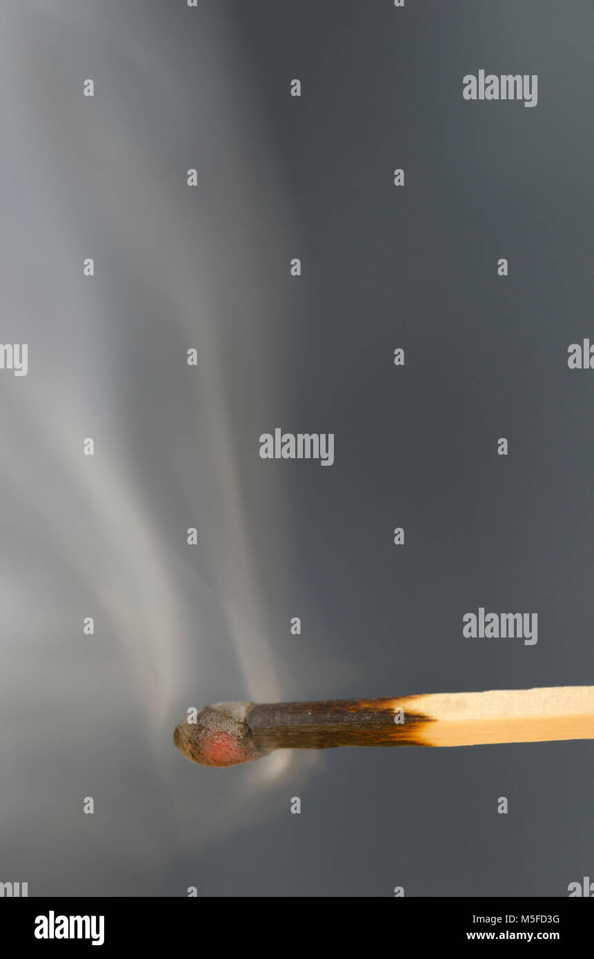 After a match burns and goes out, the smoke creates an interesting