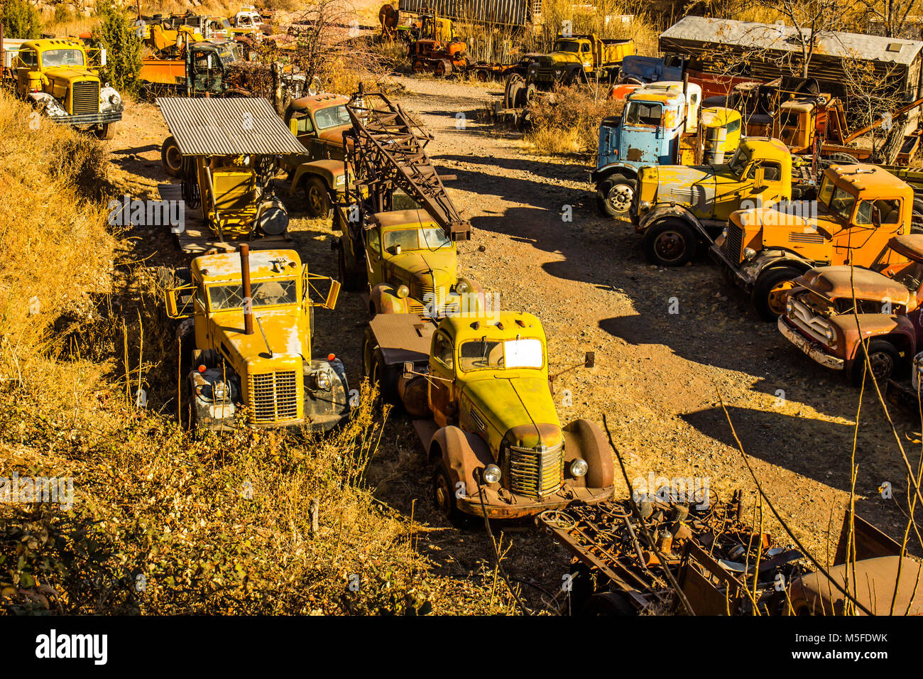 Graveyard Of Vintage Heavy Duty Vehicles In Salvage Yard Stock Photo