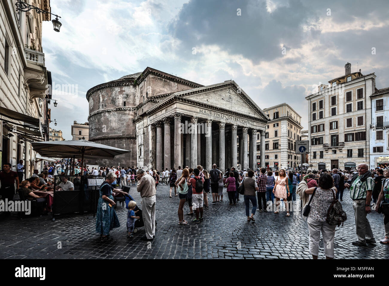 The crowded Piazza della Rotonda in Rome Italy as crowds of tourists enjoy the ancient temple and the lively sidewalk cafes Stock Photo