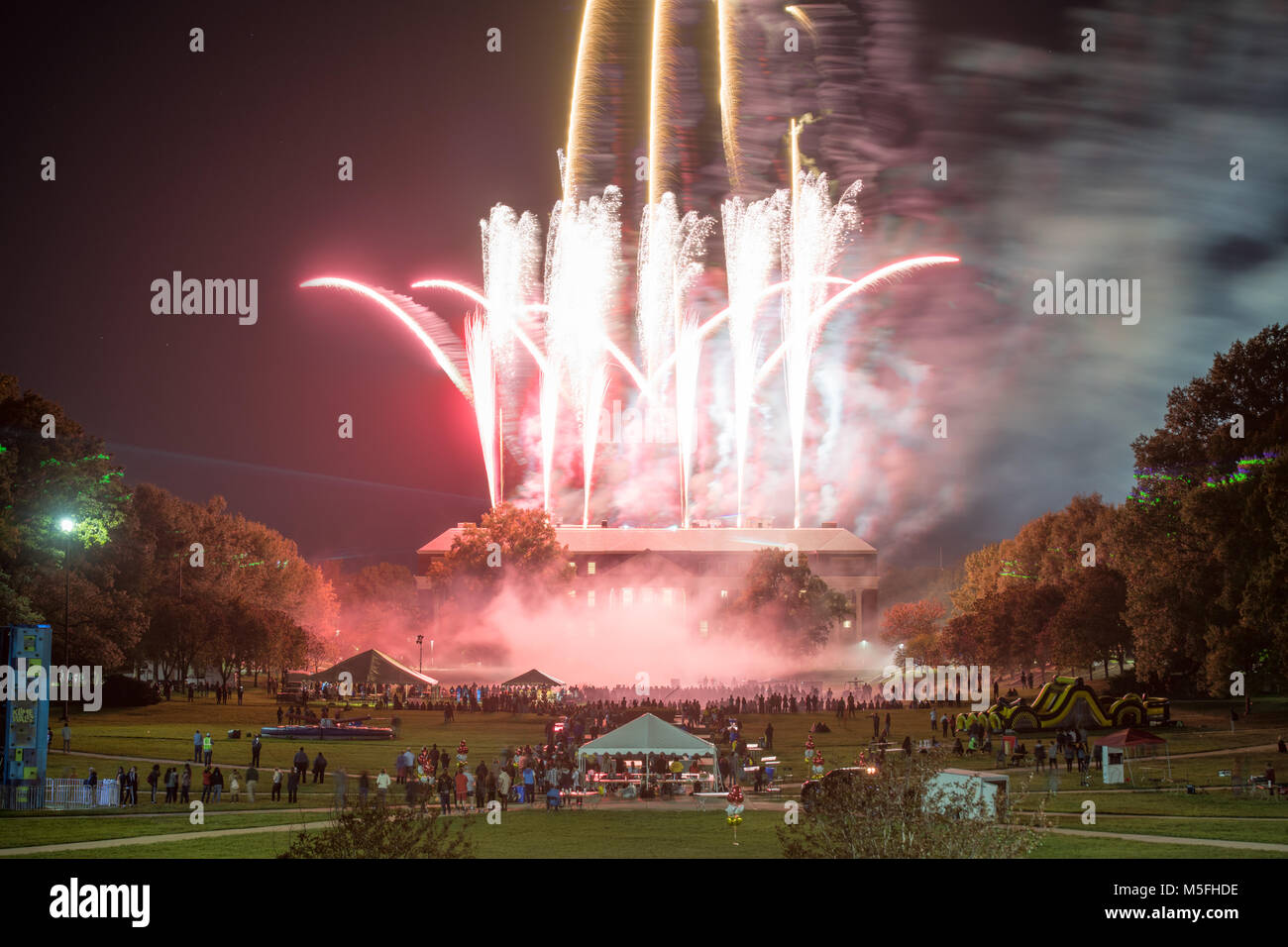 Crowd watches as firework specular goes off from McKeldin Library at