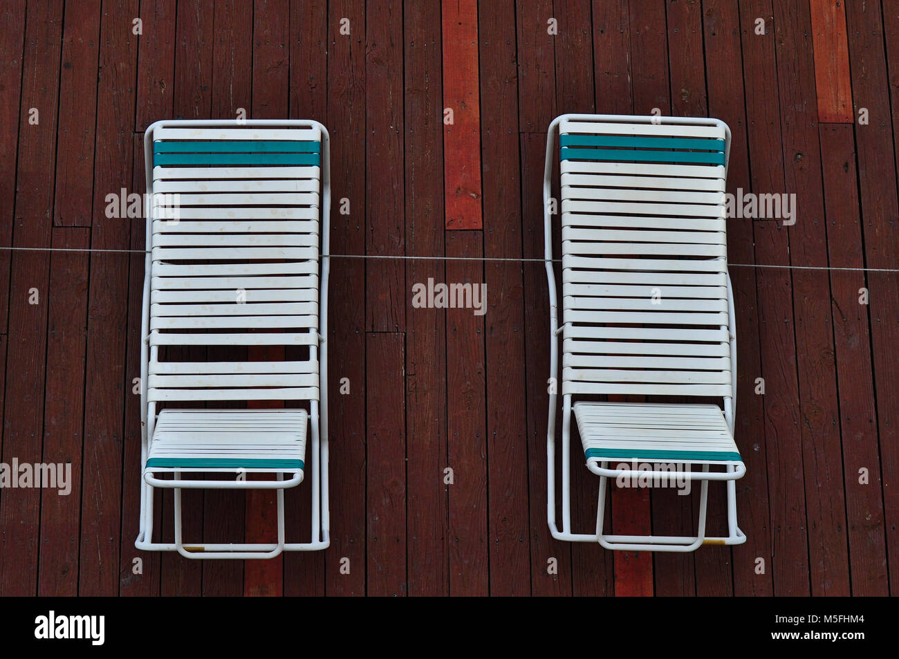 Lounge Chairs on Red Deck Stock Photo