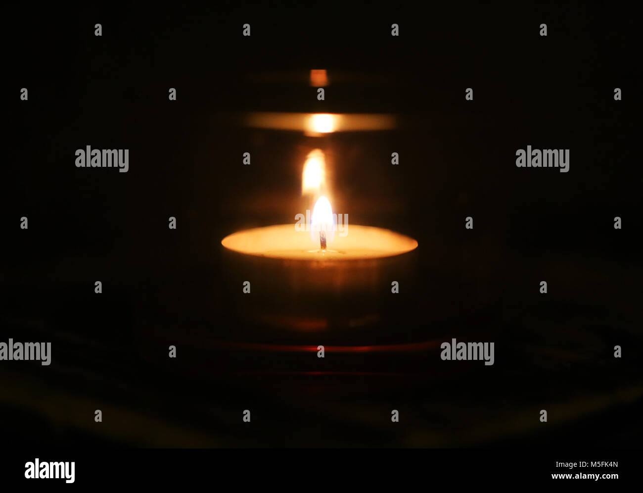 Photo of a candle in the dark Stock Photo Alamy