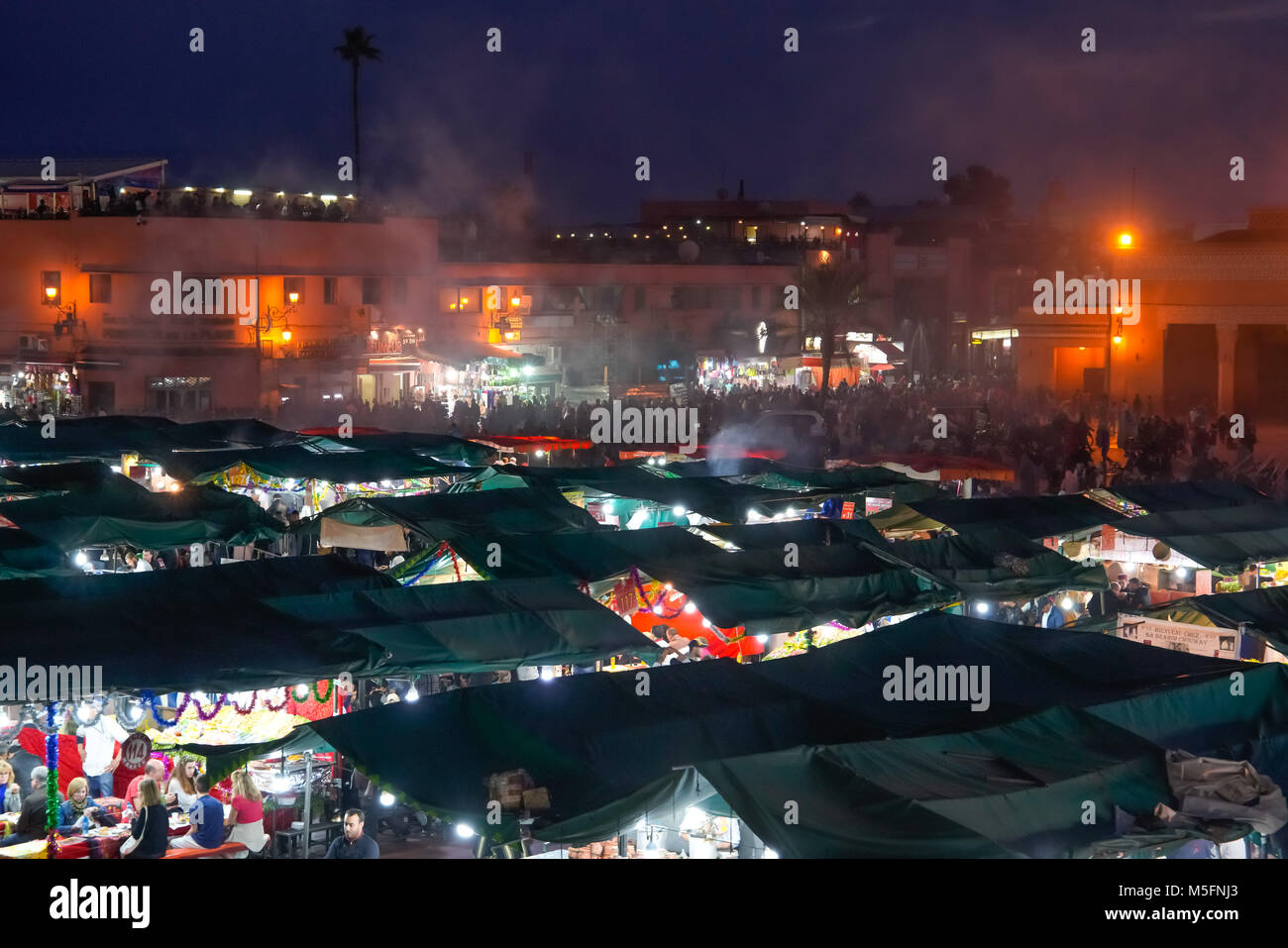 View of the famous Jamaâ El Fna Square and Koutoubia Mosque in Marrakesh, Morocco. Stock Photo