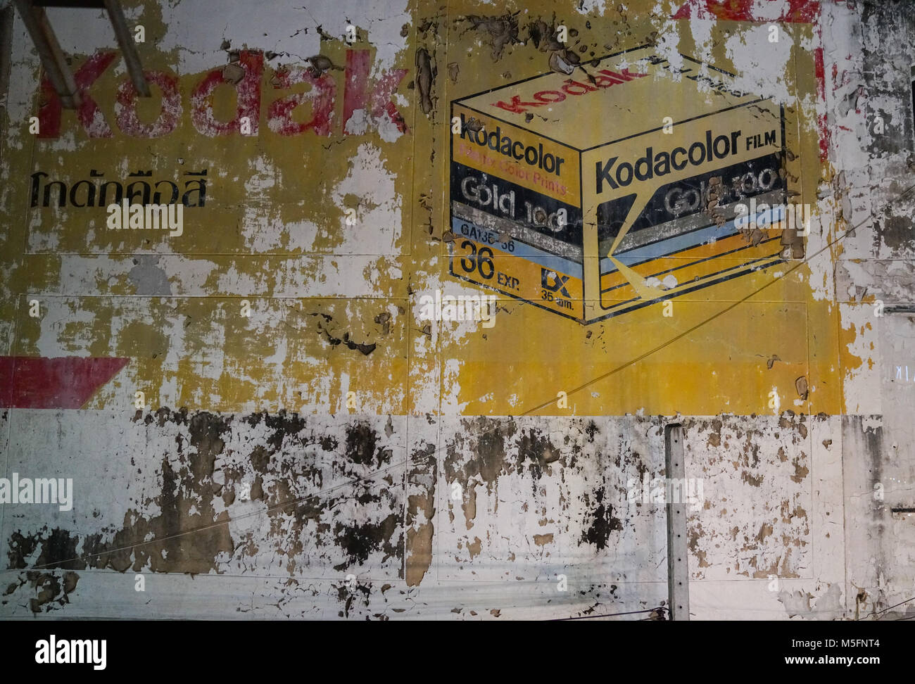 CHIANG MAI THAILAND - FEBRUARY 3 2018;  peeling painted sign of of old Kodacolor film sign on citty street Stock Photo