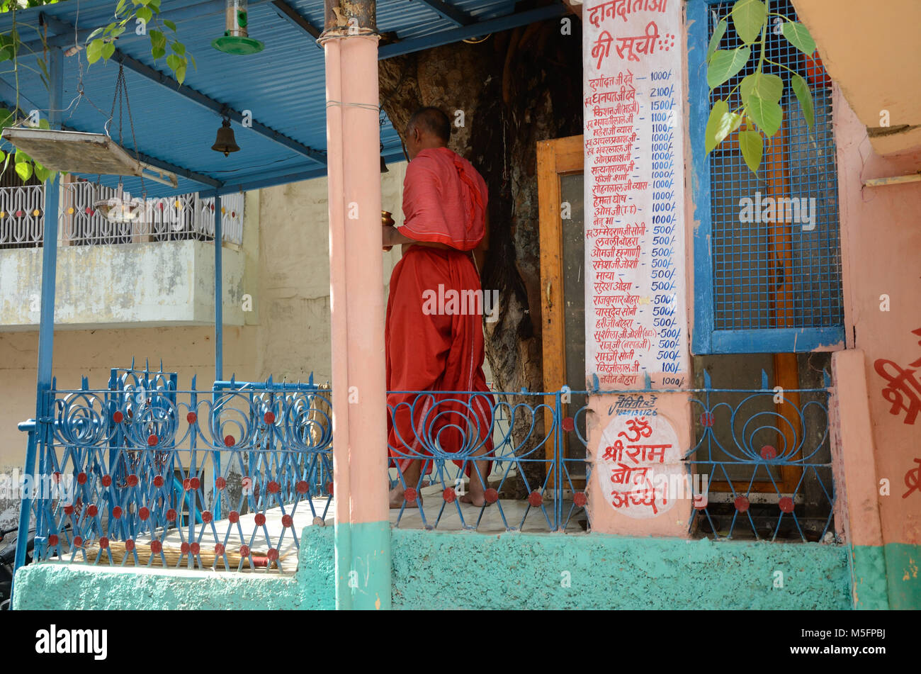 man in small temple, Jodhpur, Rajasthan, India, Asia Stock Photo
