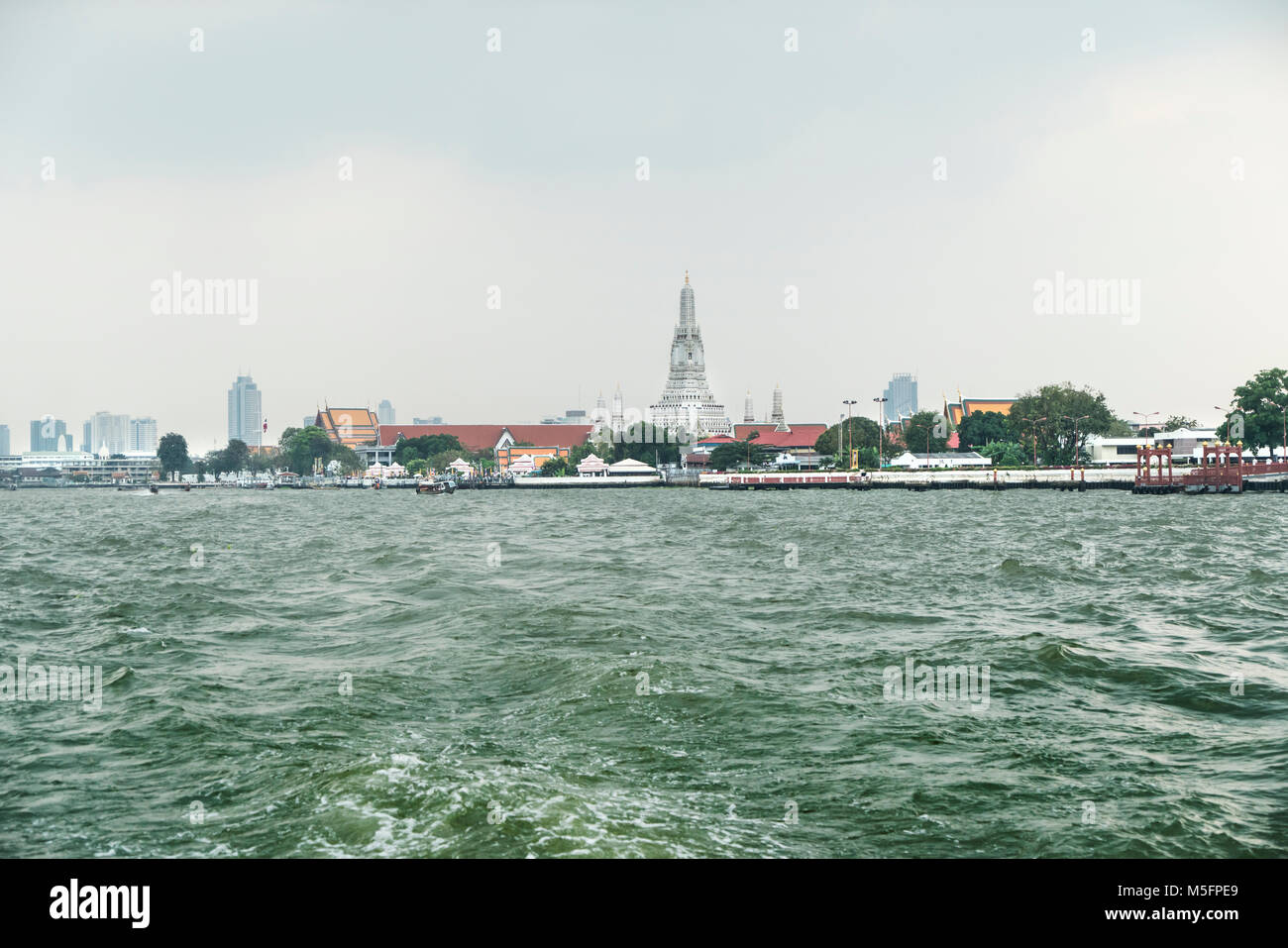 The view of Wat Arun Temple from Mae Nam Chao Phraya river in Bangkok, Thailand Stock Photo
