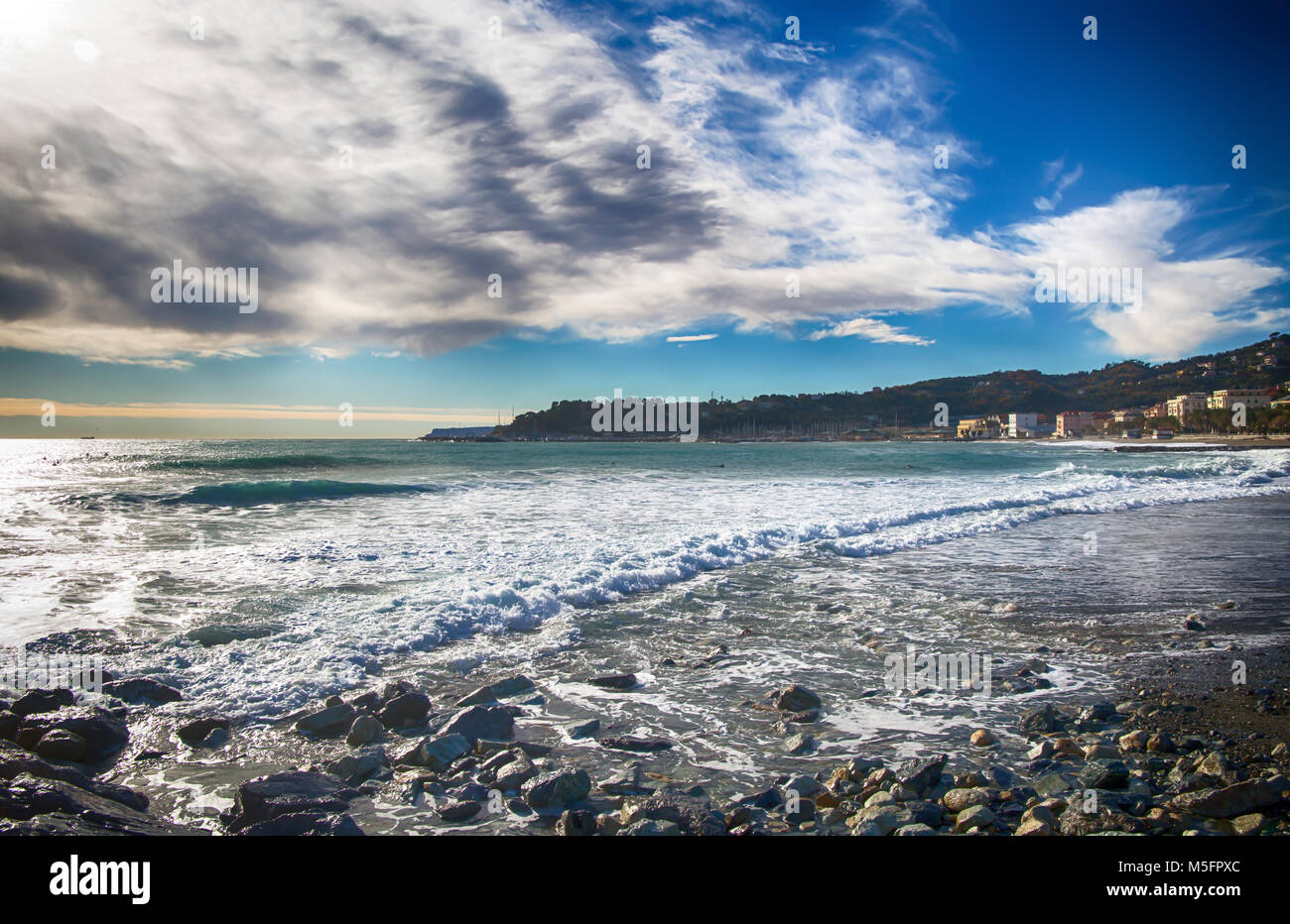 The Beach under a cloudy sky Stock Photo - Alamy