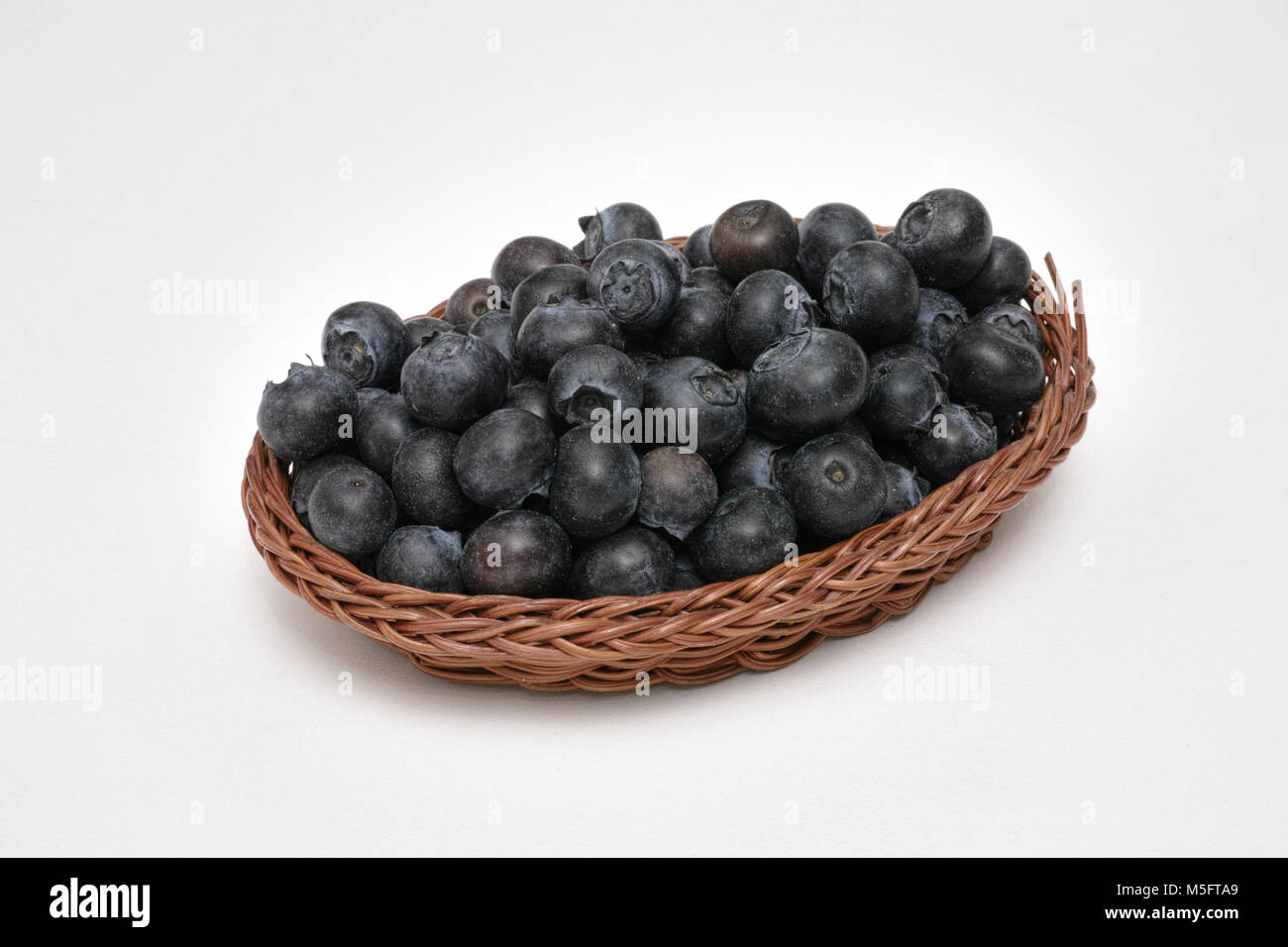 fruits of blueberry plant in a little  basket Stock Photo
