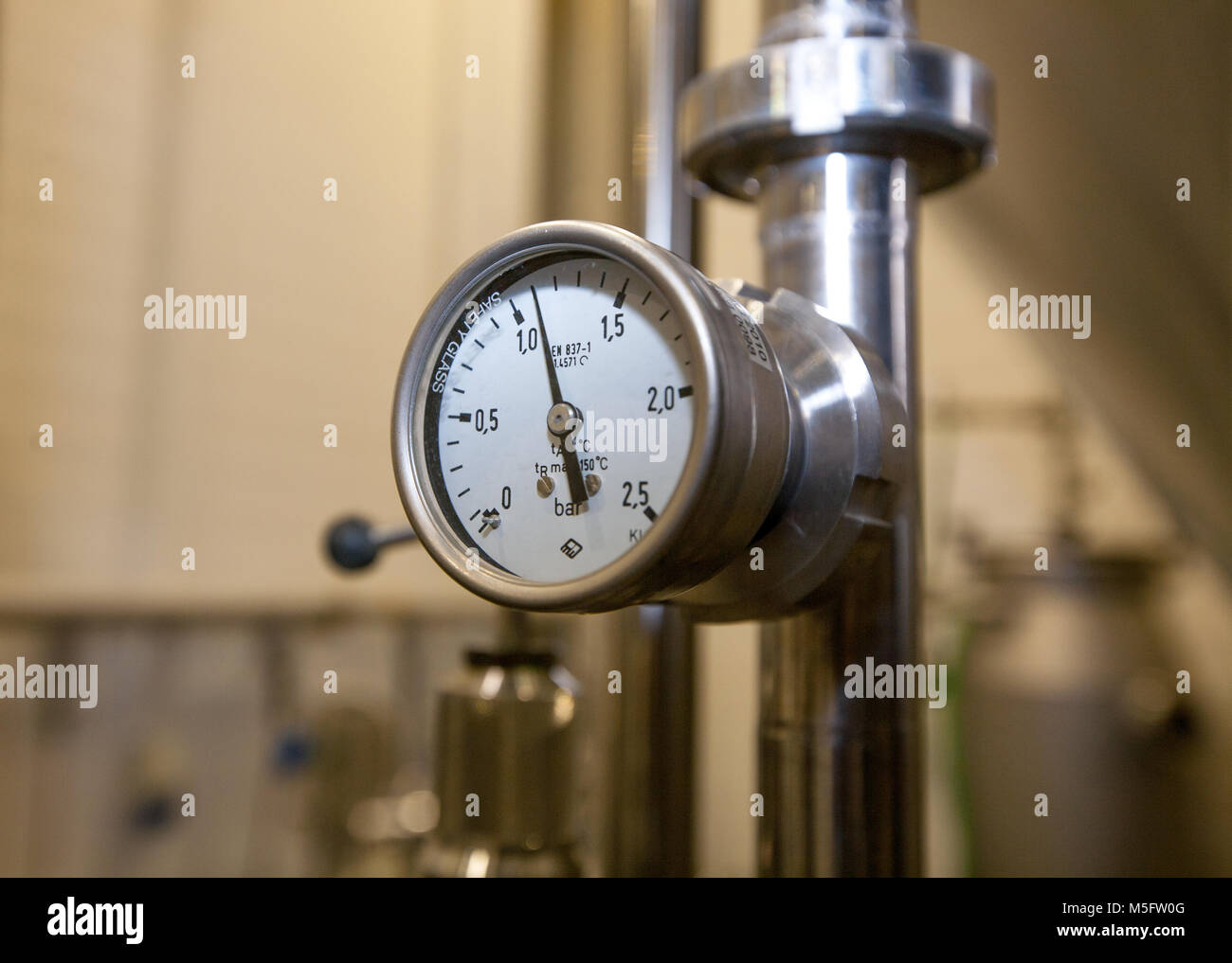 Pressure gauge (manometer) of white metal - brewing equipment. Close-up ...