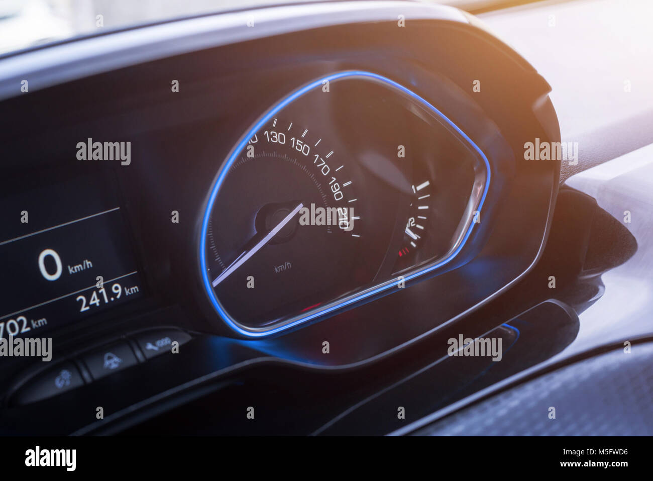 Car speedometer close up. Modern blue interior design. Stock Photo
