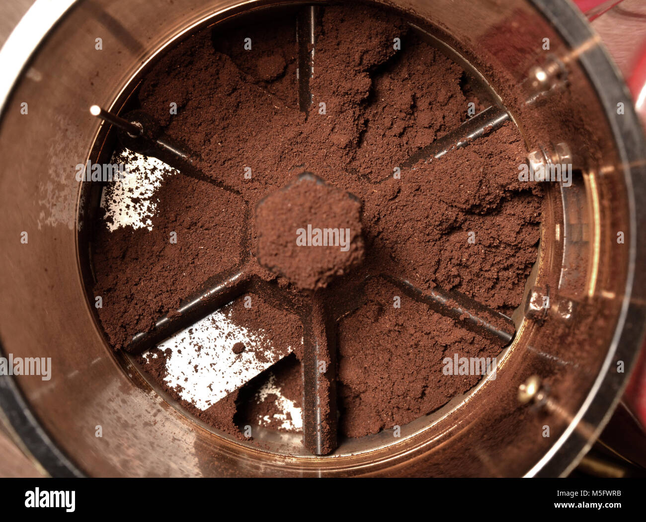 Coffee powder in grinds container, a top view closeup photo of coffee powder in grinds container