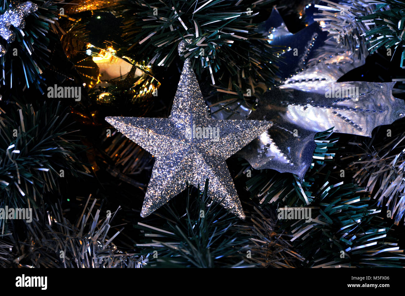Christmas tree decoration, christmas tree that decorate by silver star and goden xmas balls for celebration in christmas time, xmas background, xmas c Stock Photo