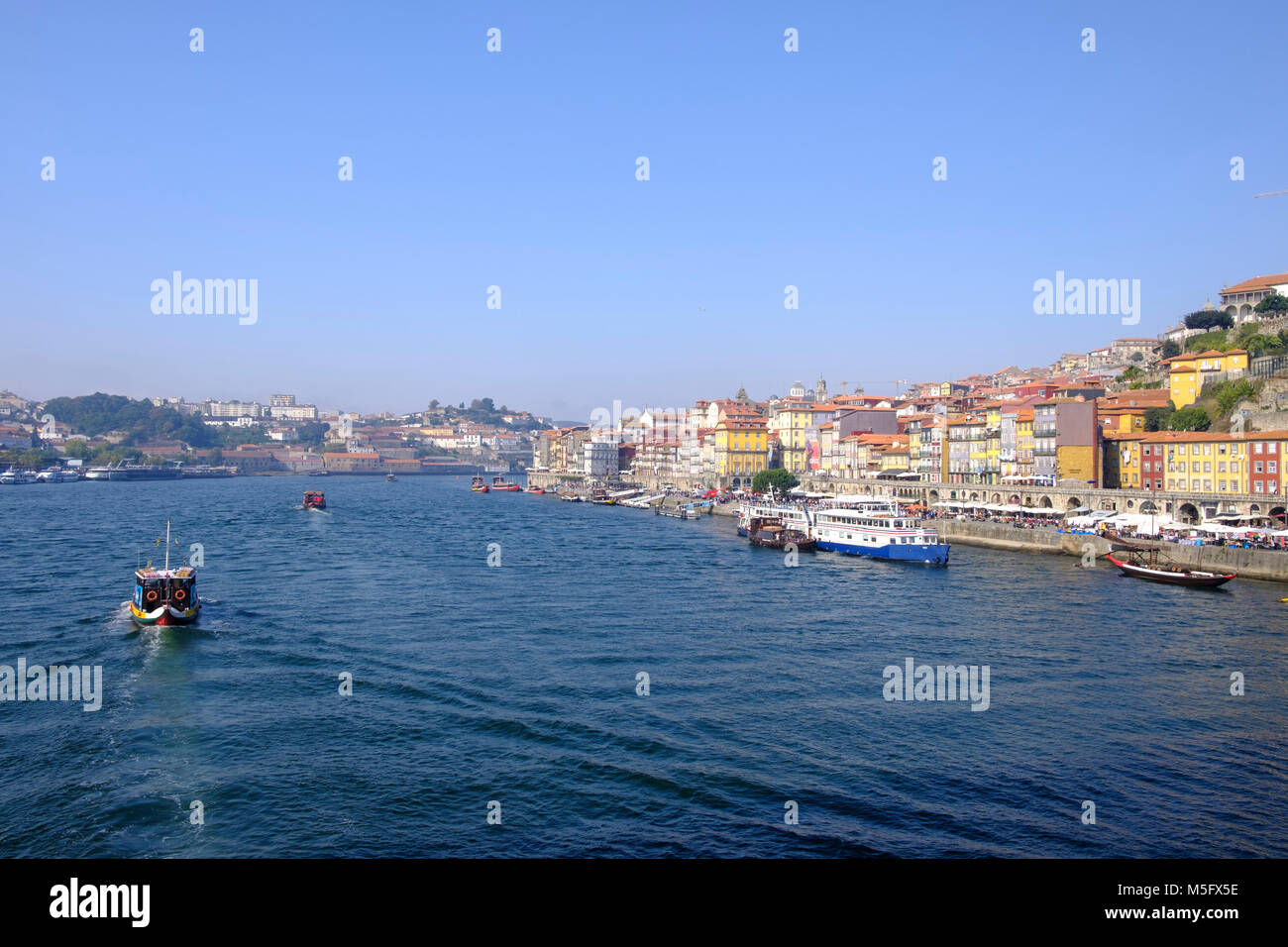 Douro River waterfront in Barrio La Ribeira with boat traffic, Porto, Porto Region, Portugal Stock Photo