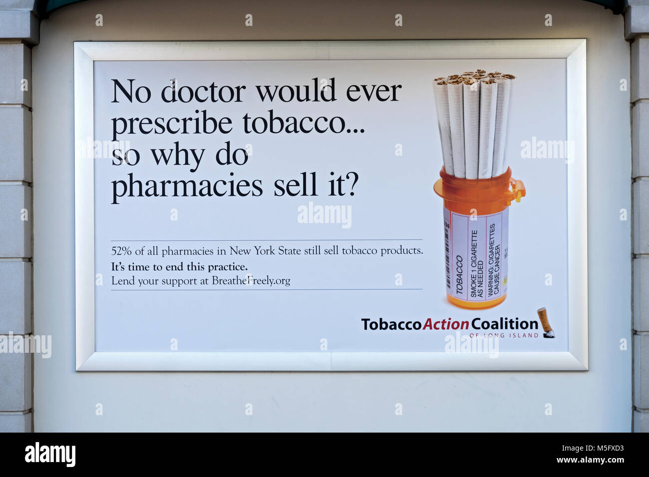 A poster in the Tanger Outlet Mall in Deer Park, Long Island urging pharmacies to stop selling tobacco products. Stock Photo