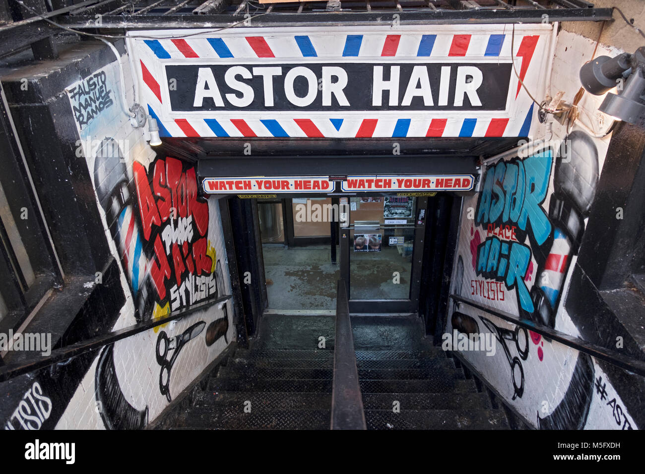 The entrance to Astor Place Hair a trendy and legendary unisex barber shop on Astor Place in Greenwich Village, Manhattan, New York City. Stock Photo