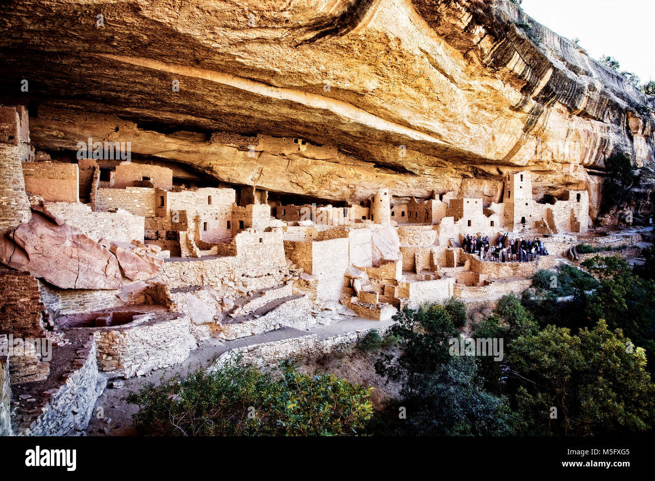 Visitors tour the Cliff Palace ruins at Mesa Verde National Park ...
