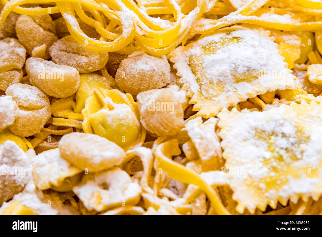 Fresh Italian pasta varieties, closeup, background. Homemade Italian