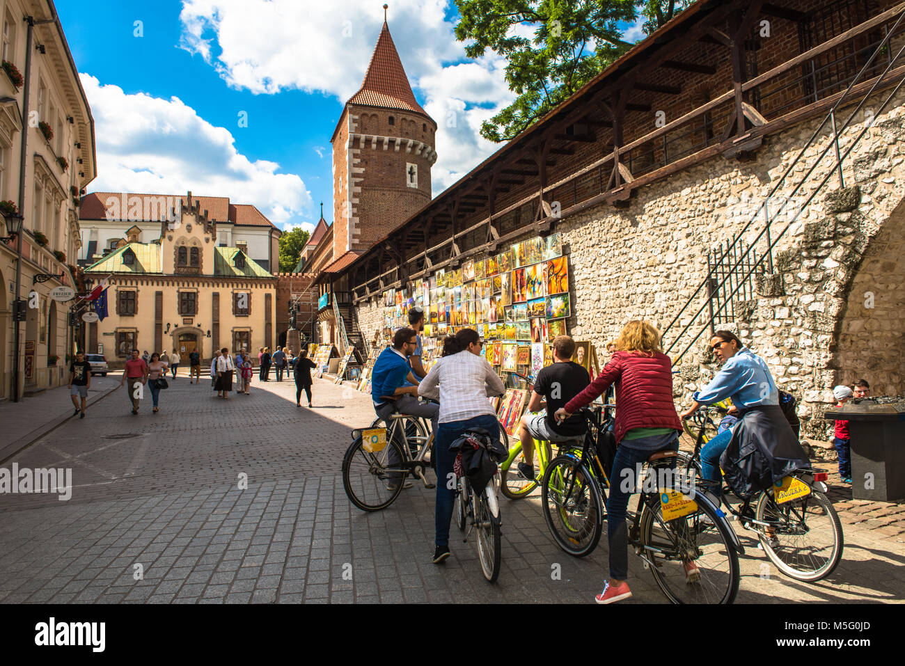 Krakow, Poland - August, 2017: city street and bile tour in downtown area Stock Photo