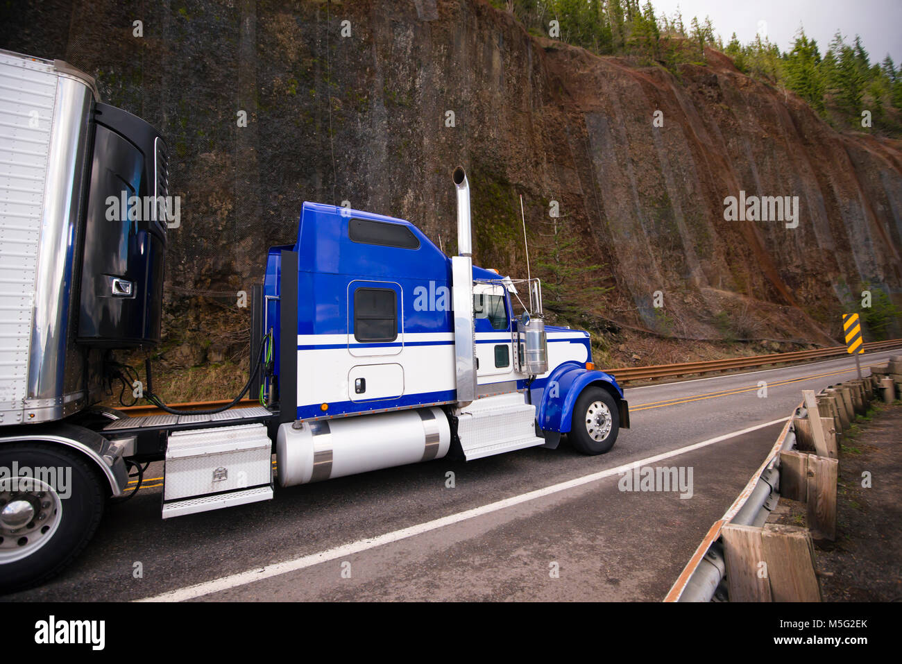Blue classic American make big rig semi truck with stainless steel ...