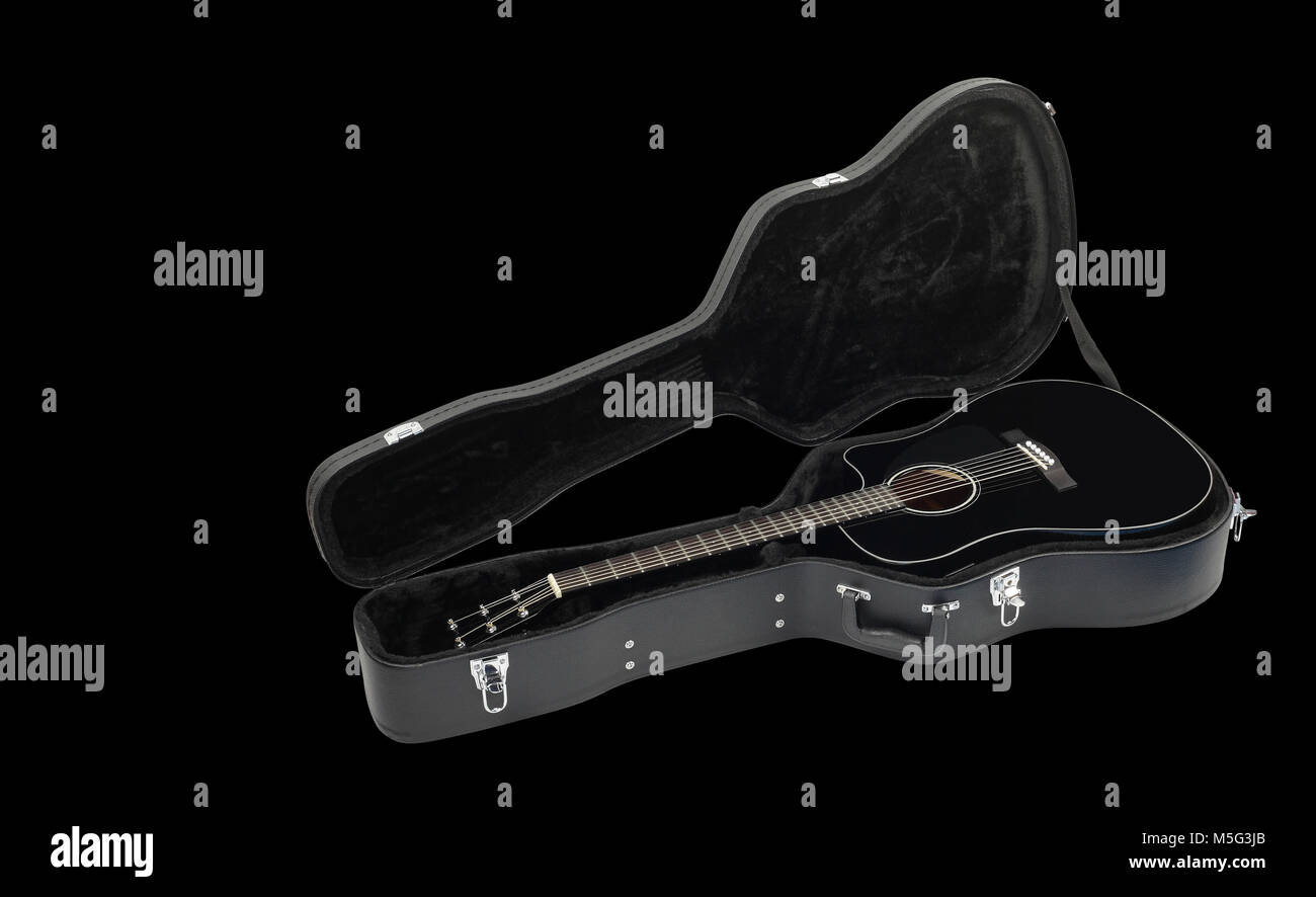 Musical instrument - Acoustic guitar hard case on a black background. Stock Photo