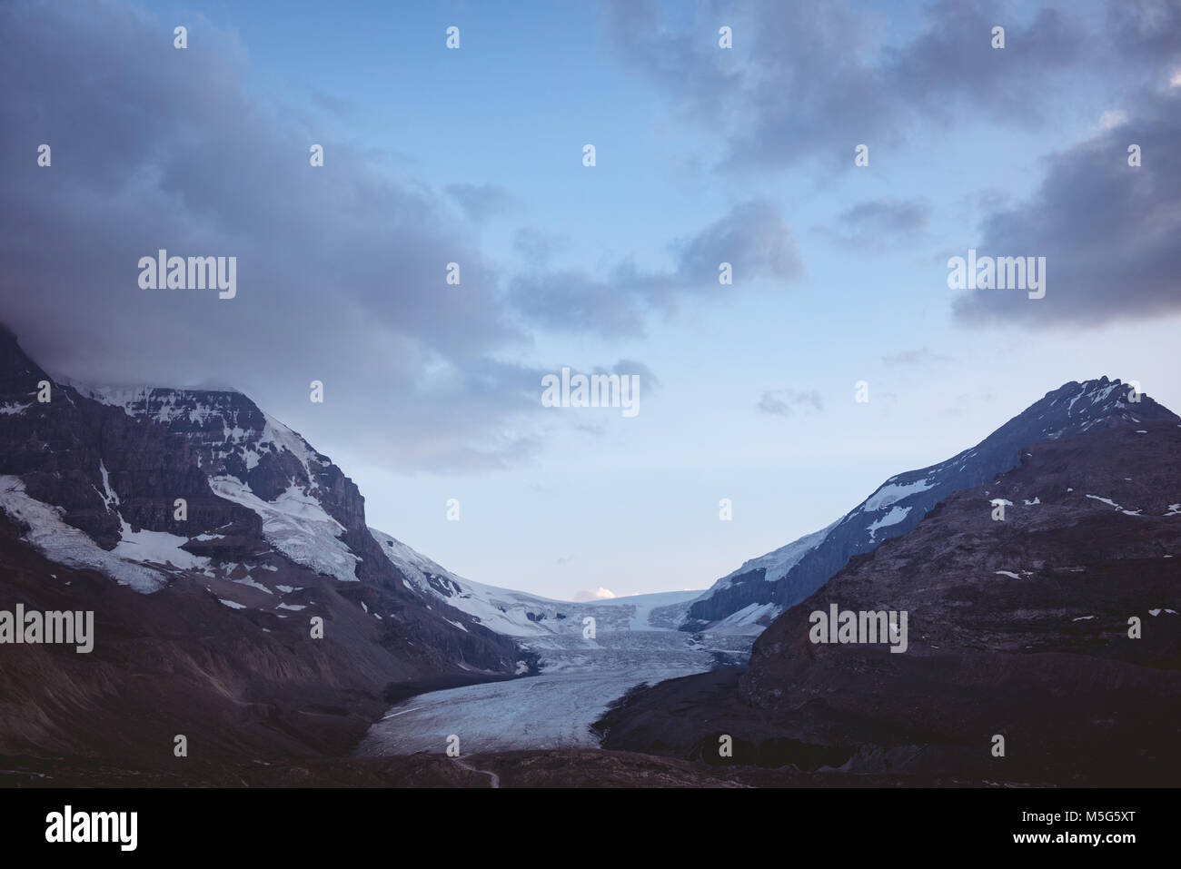 Snow capped mountains on a sunny day Stock Photo - Alamy
