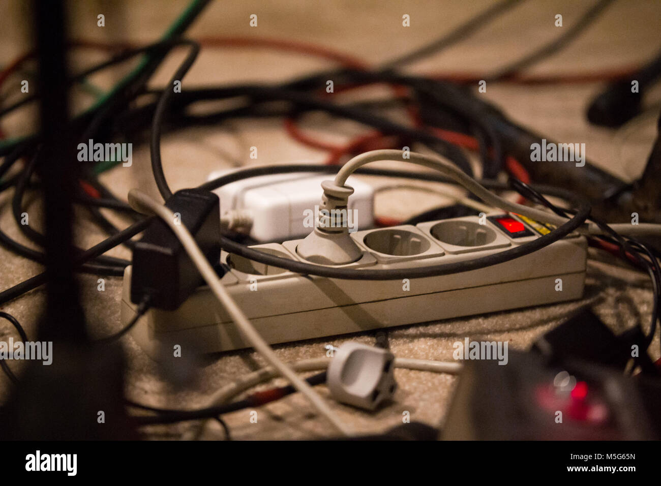 Randomly wiring on floor and extension cable Stock Photo Alamy