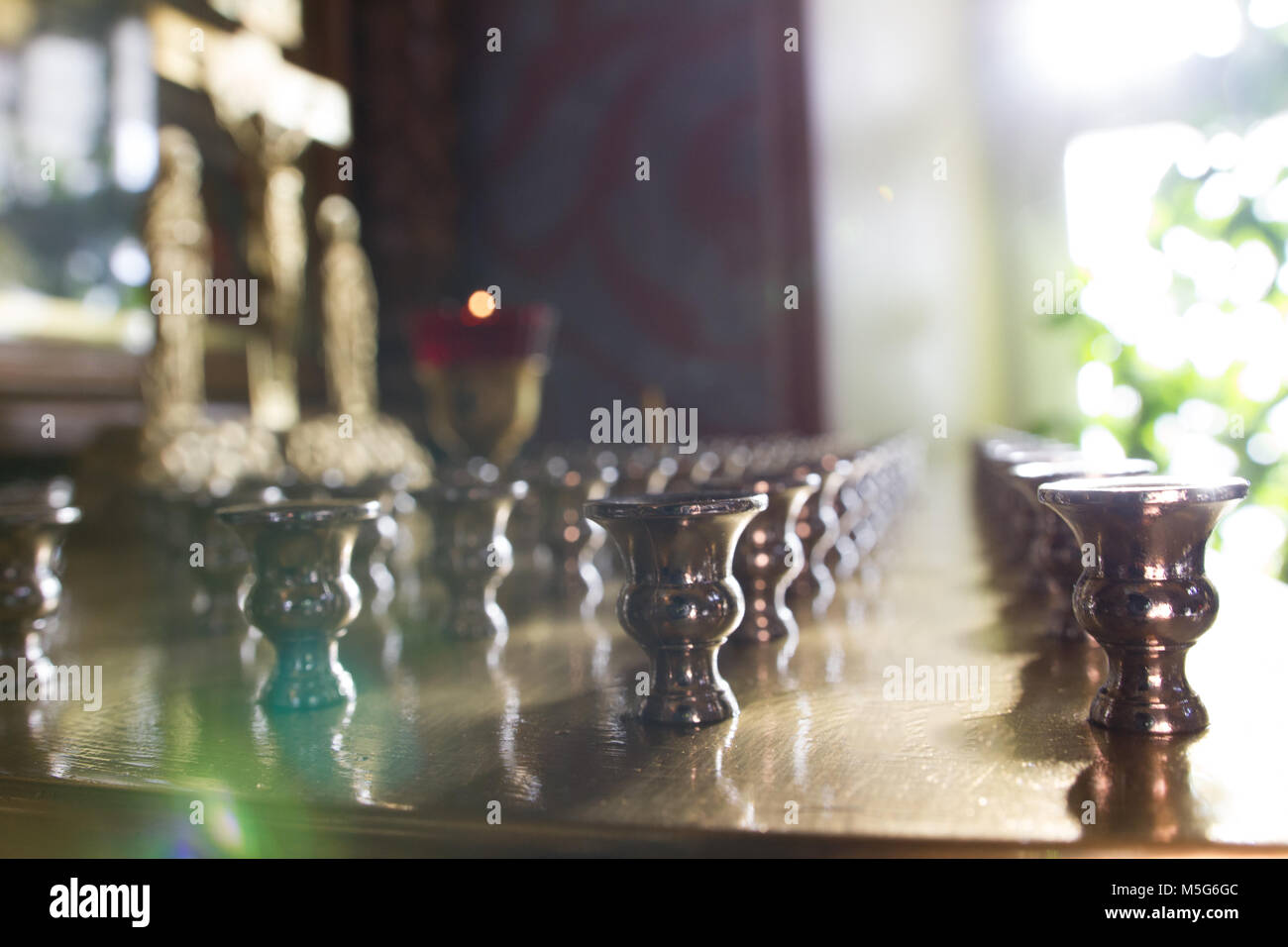 Inside Christian Church close up view of candle holder in orthodox