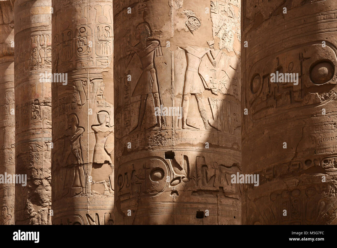 Reliefs on columns in Great Hypostyle Hall in Karnak Temple, Luxor, Egypt Stock Photo
