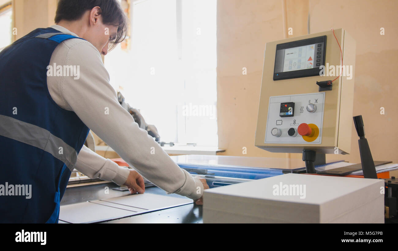 Press operator produces printing Stock Photo Alamy