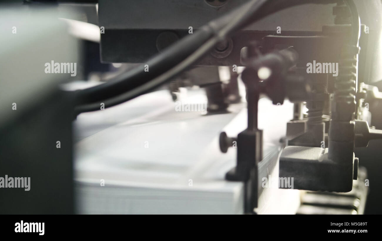 Printed sheets of paper are served in the printing press. Offset , CMYK ...