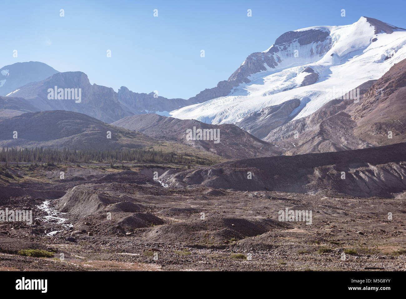 Snow capped mountains on a sunny day Stock Photo - Alamy