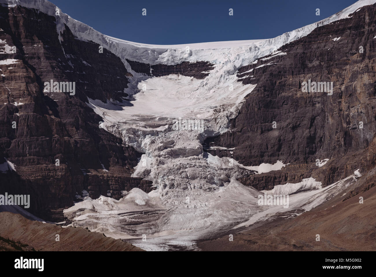 Snow capped mountain on a sunny day Stock Photo - Alamy