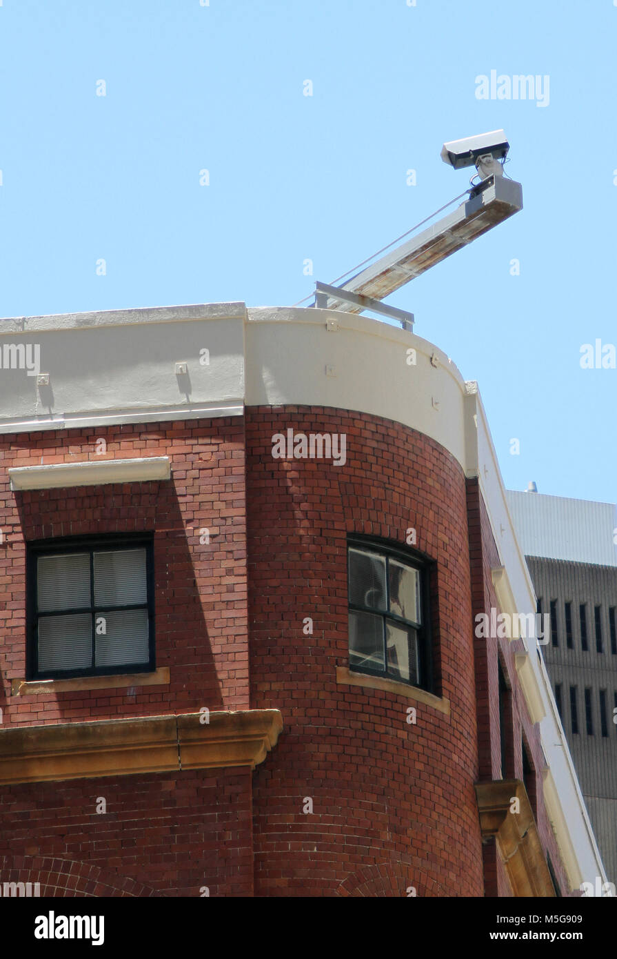 Security camera attached to the roof of a building, Sydney, Australia Stock Photo