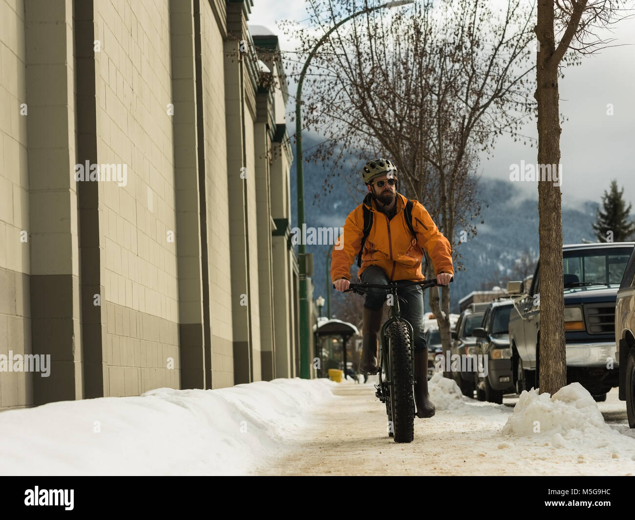 riding bicycle on sidewalk