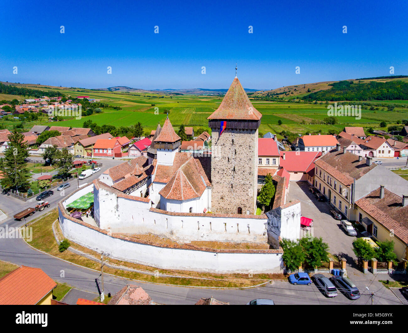 Homorod Fortified Church build by the German Saxons in Transylvania. Aerial view Stock Photo