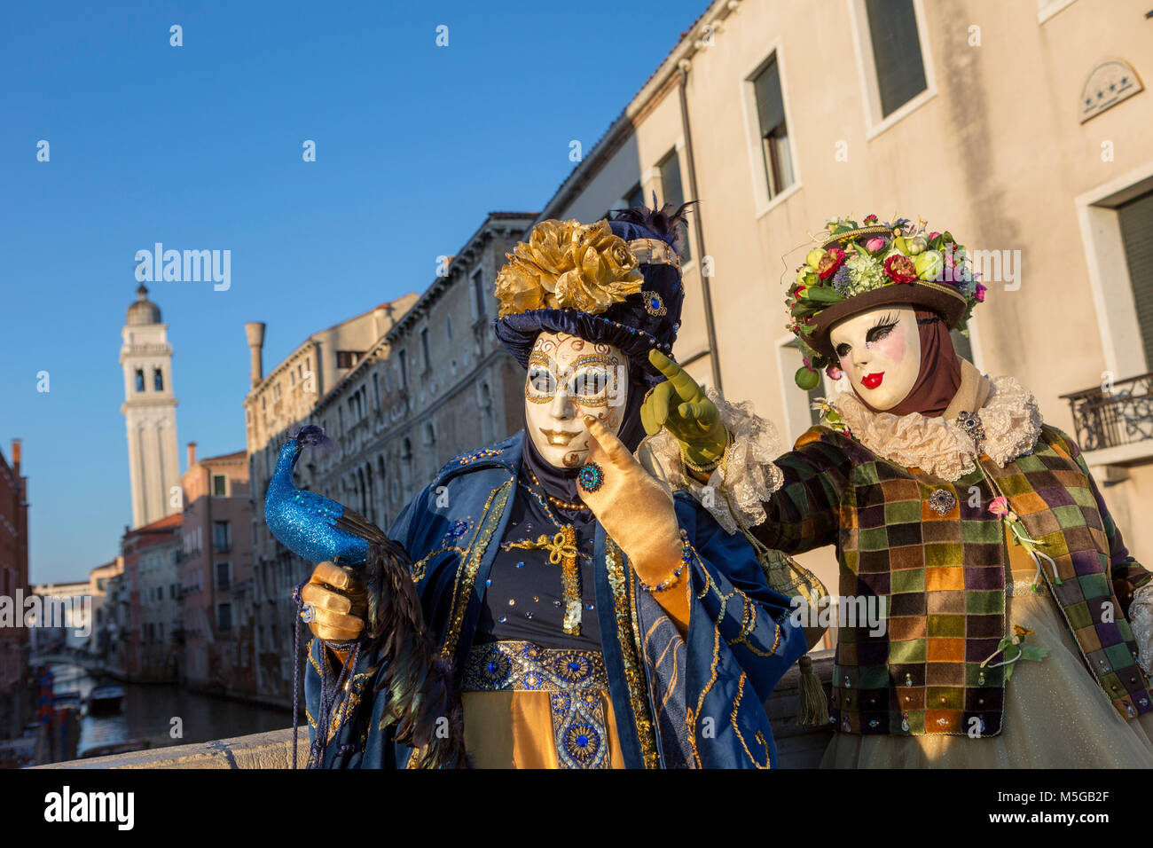 Two people in costume at the Venice Carnival Stock Photo - Alamy