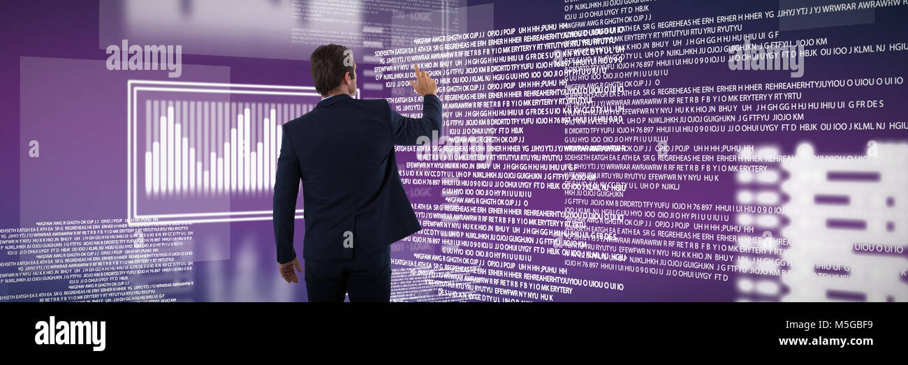 Composite image of businessman pressing an invisible virtual screen Stock Photo