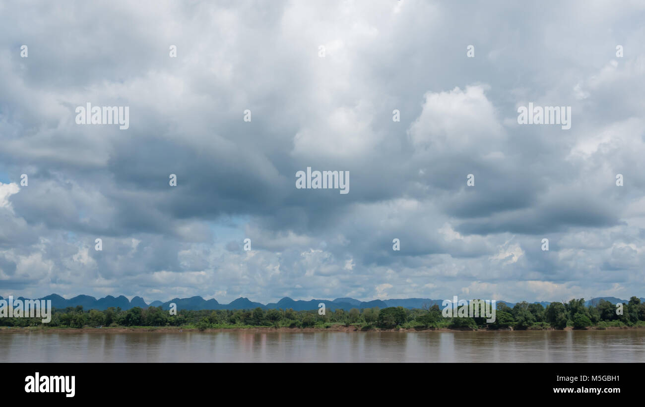 White fluffy clouds on a blue sky background Stock Photo - Alamy