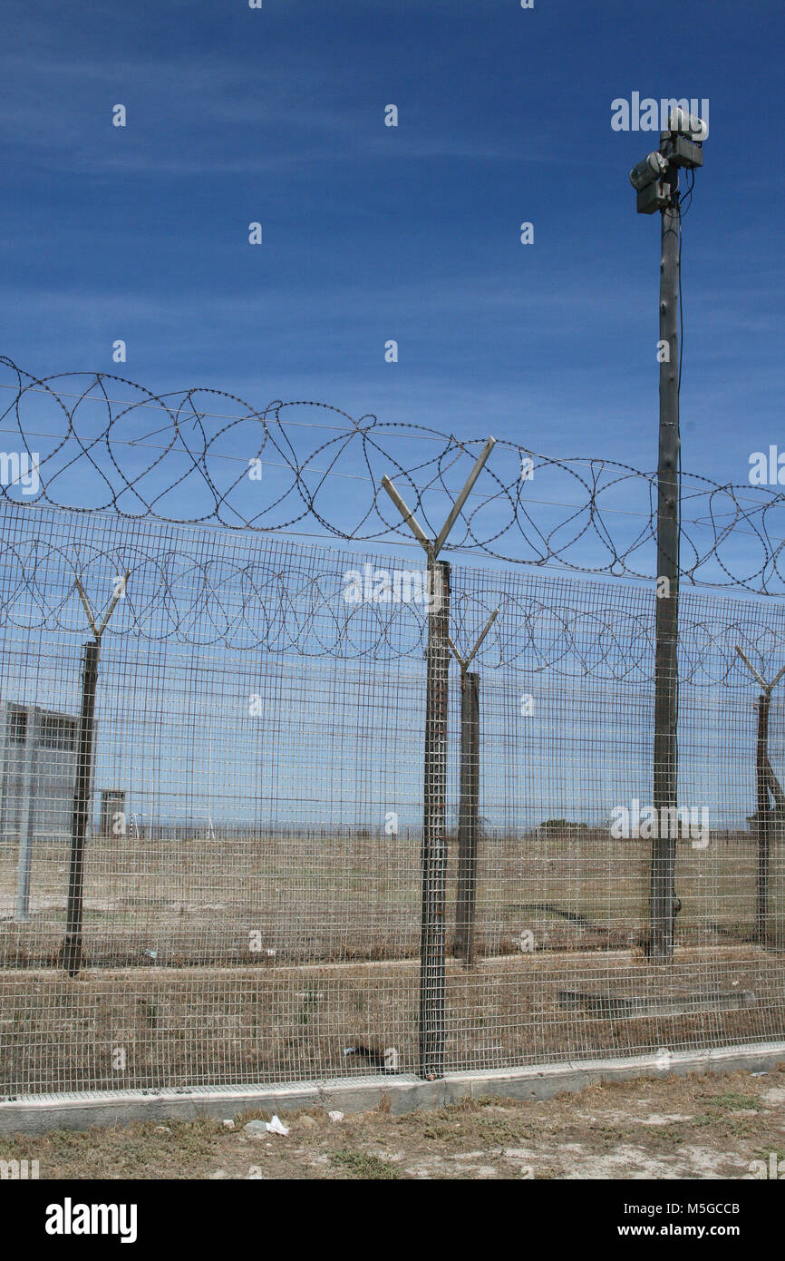Barbed wire fence on Robben Island, former prison, Cape Town, South Africa Stock Photo