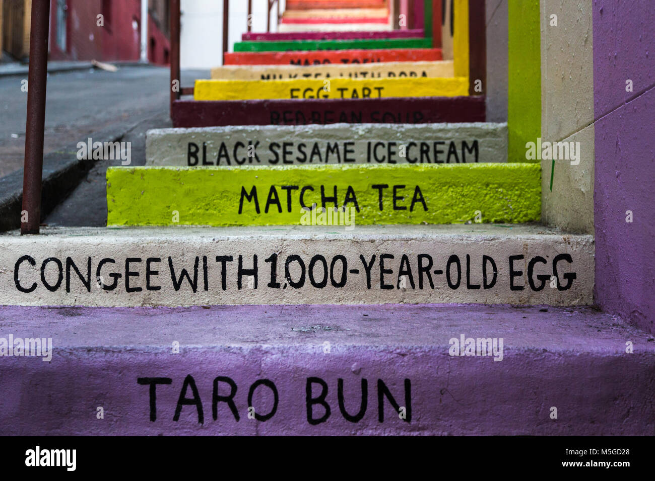 Menu of Chinese food painted onto steps outside a restaurant in Chinatown, San Francisco Stock Photo