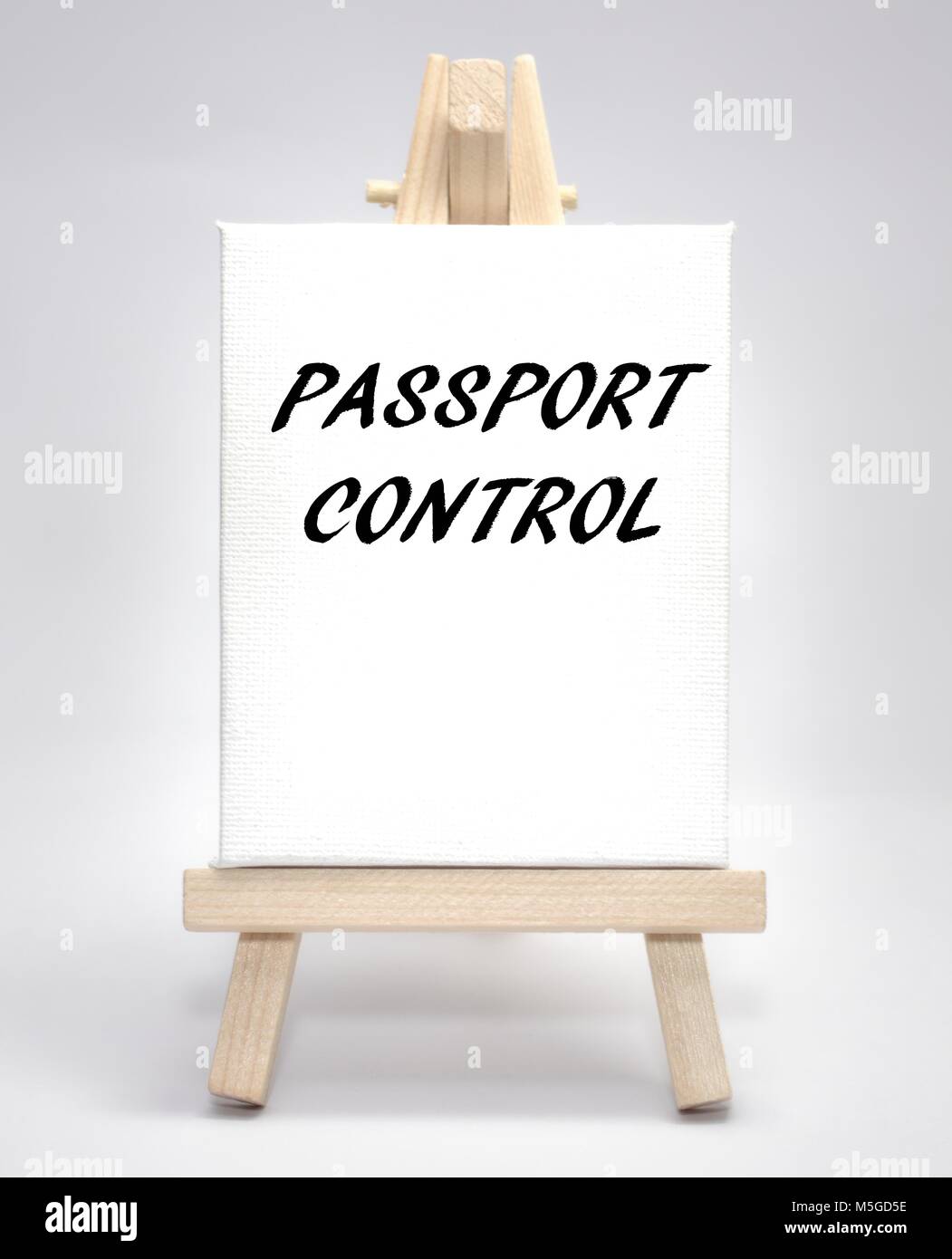 Passport control concept white canvas artist easel Stock Photo