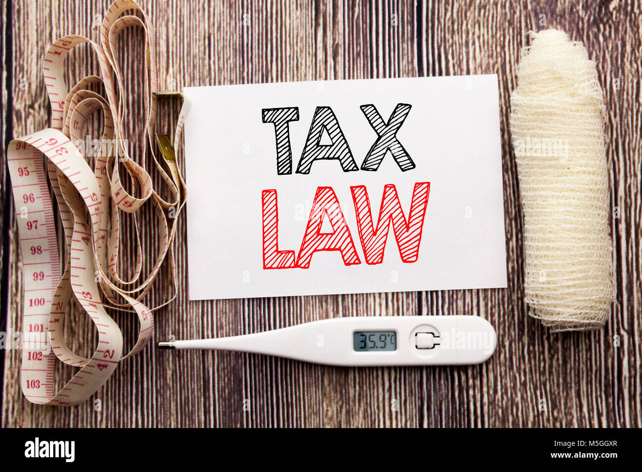 Handwritten text showing Tax Law. Business fitness health concept writing for Taxation Taxes