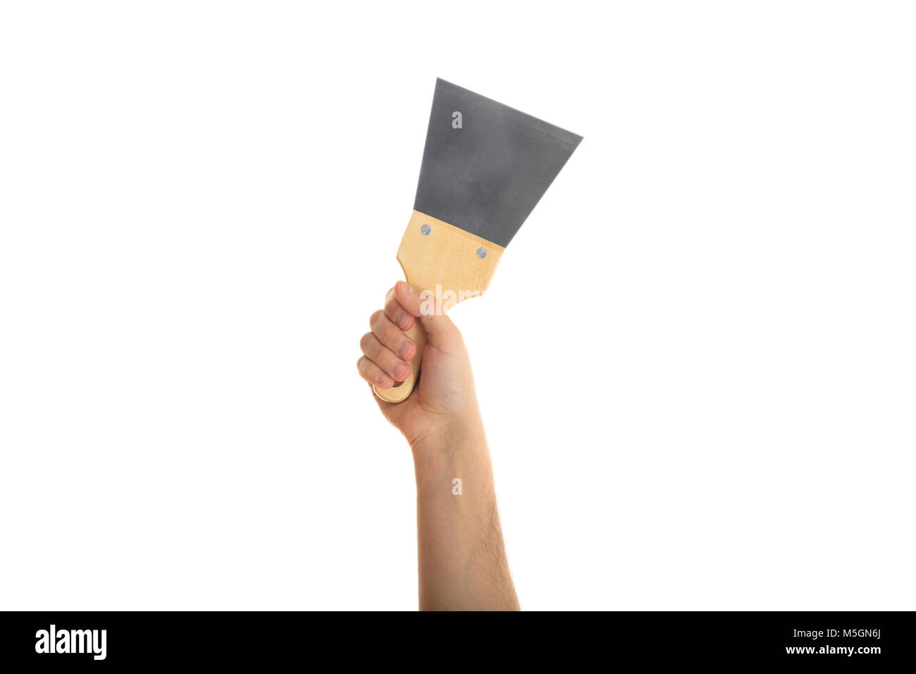 Hand holding a metal spatula on white background Stock Photo Alamy