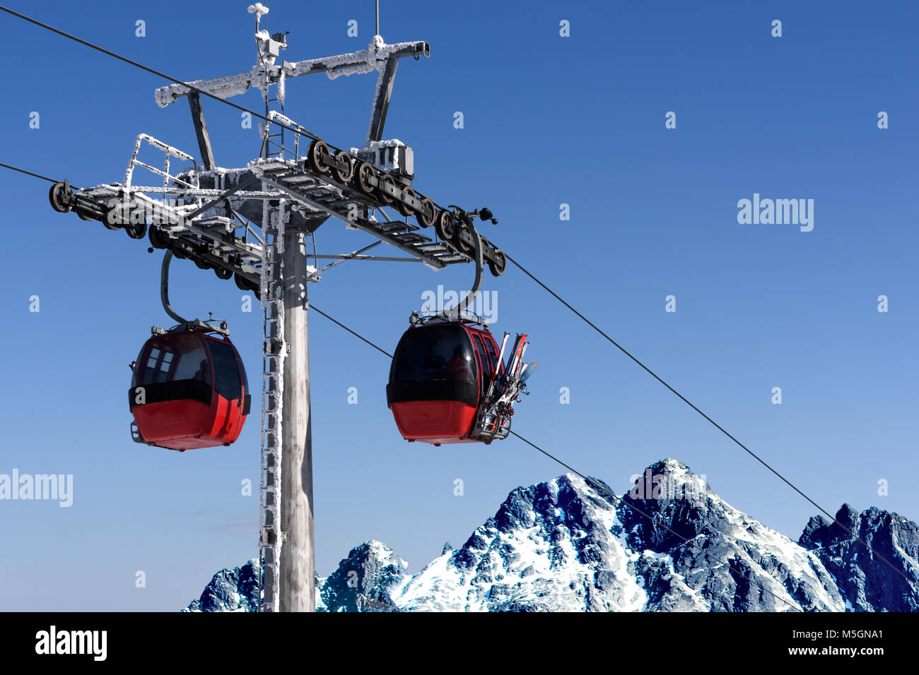 Gondola Cabin Lift In The Ski Resort Over The High Mountains On