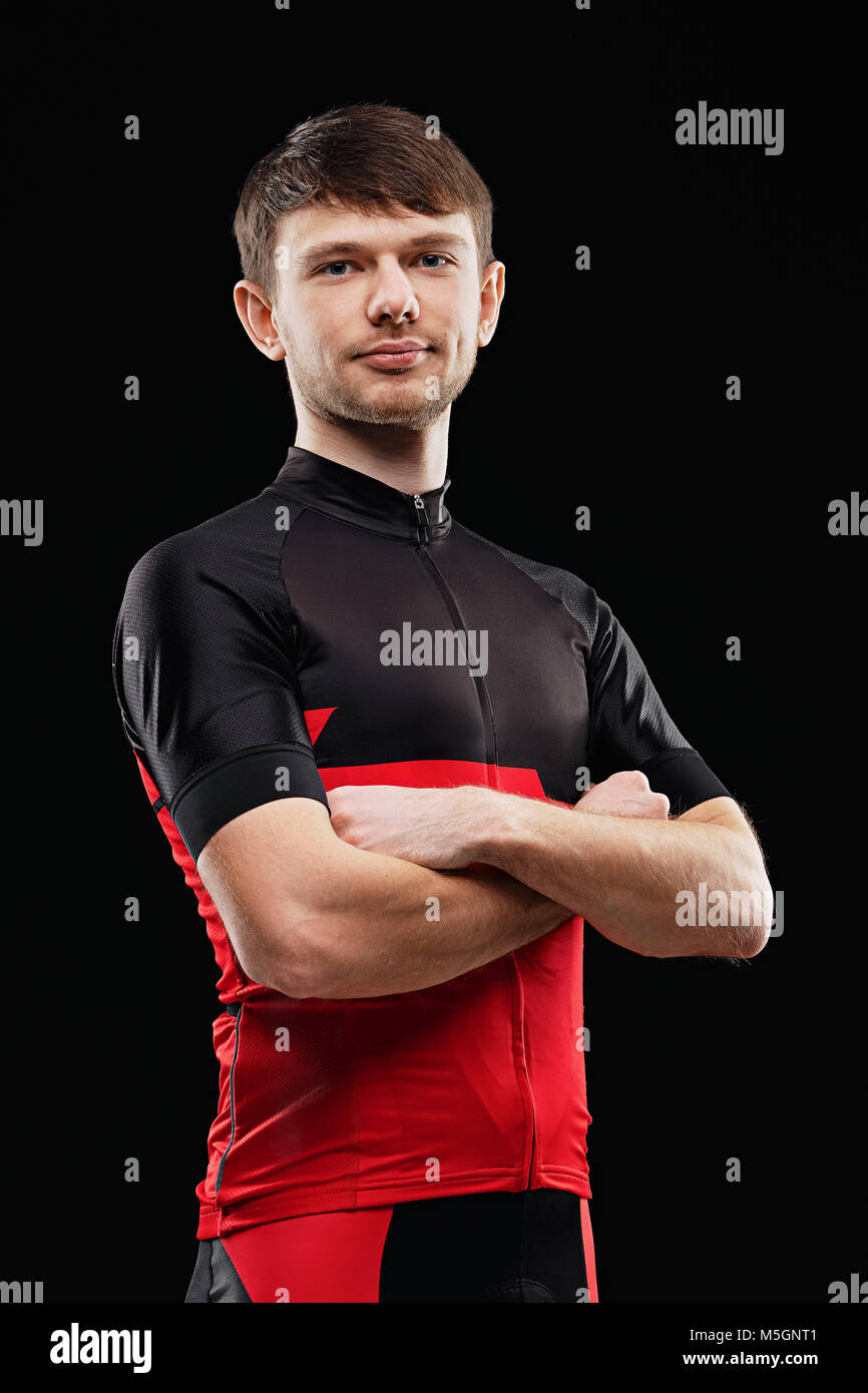 Sport. Cyclist in training clothes on black background. Stock Photo