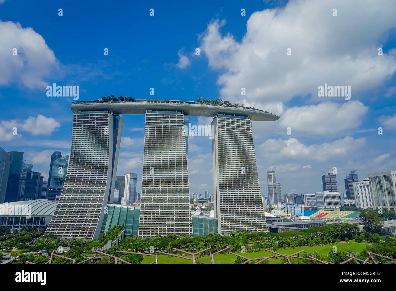 The Marina Bay Sands Building in Singapore against a blue sky