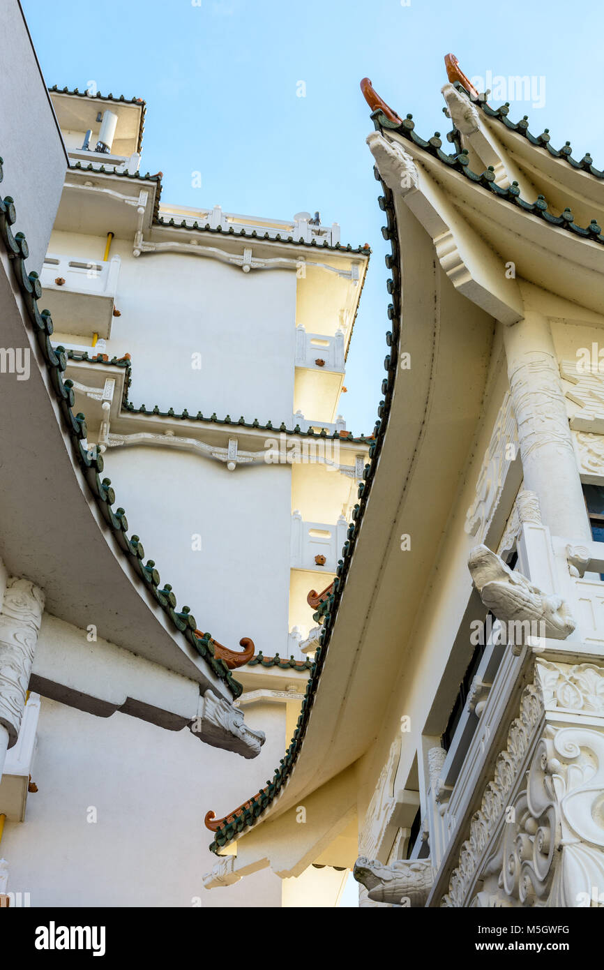 View of the chinese-inspired architecture of the Huatian Chinagora hotel complex with curved roof corners and traditional glazed roof tiles. Stock Photo