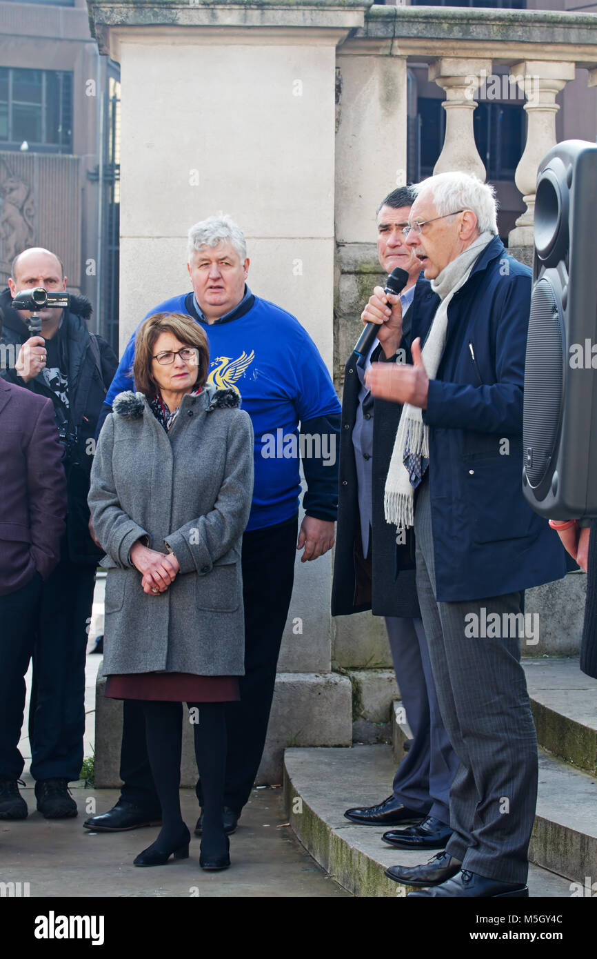 Liverpool, UK. 23rd February 2018. Anti-Brexit campaigners big red bus arrives in Derby Sq Liverpool. The 'Is It Worth It?' campaign claims the cost of leaving the EU will be £2,000m per week. Local MP Louise Ellman was one of the guest speakers and is seen here listening to Cllr Richard Kemp CBE  the Leader of the Liberal Democrats on Liverpool City Council.  Credit: Ken Biggs/Alamy Live News. Stock Photo